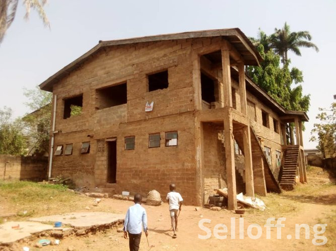 Uncompleted Two units of 2 bedroom flats upstairs and 8 rooms downstairs on a full plot of land.