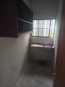 A room and Parlor self contain, terazo, water running, well fenced and gated 8