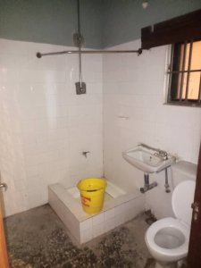 A room and Parlor self contain, terazo, water running, well fenced and gated 3